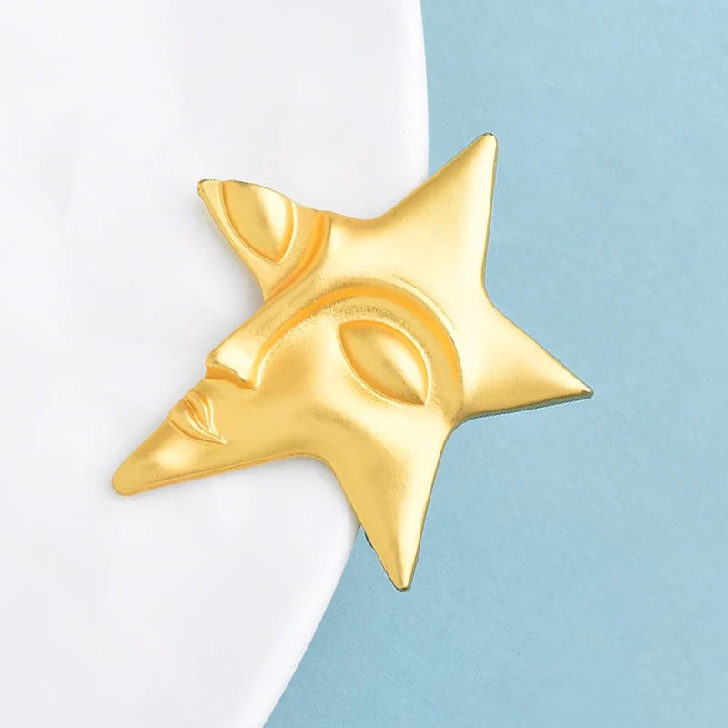 Broche Visage