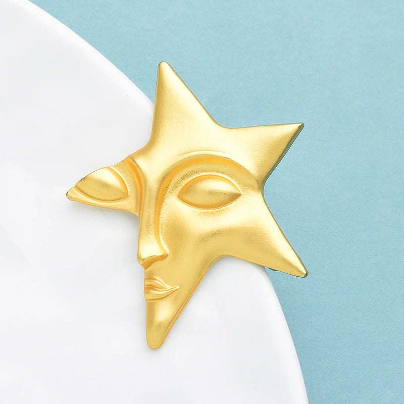 Broche Visage