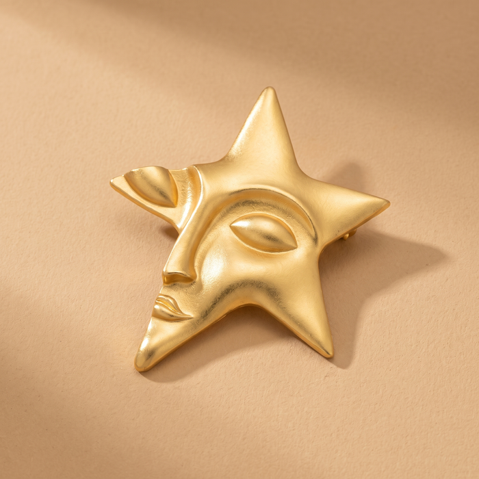 Broche Visage