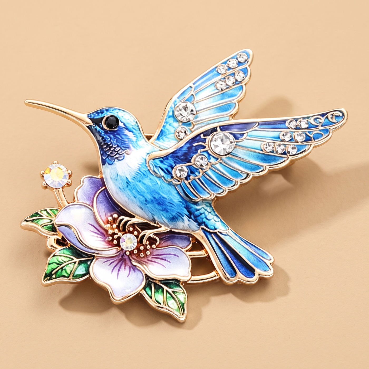 Broche Colibri, bijou fantaisie vintage Alyvoa présentée sur un coussin · Bleu